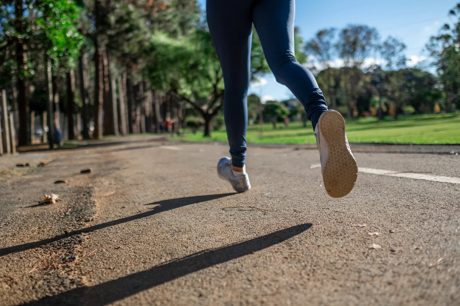 A person running on a road. 