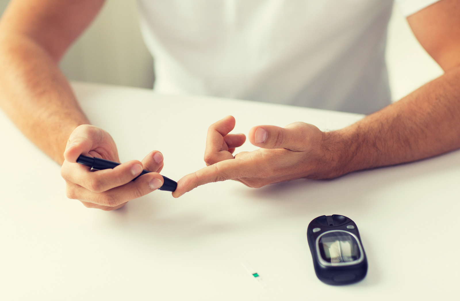 A man checking his blood sugar levels. 