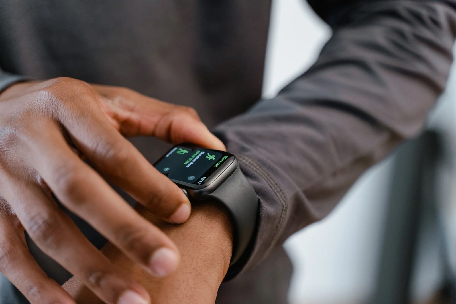 A person using a smartwatch. 