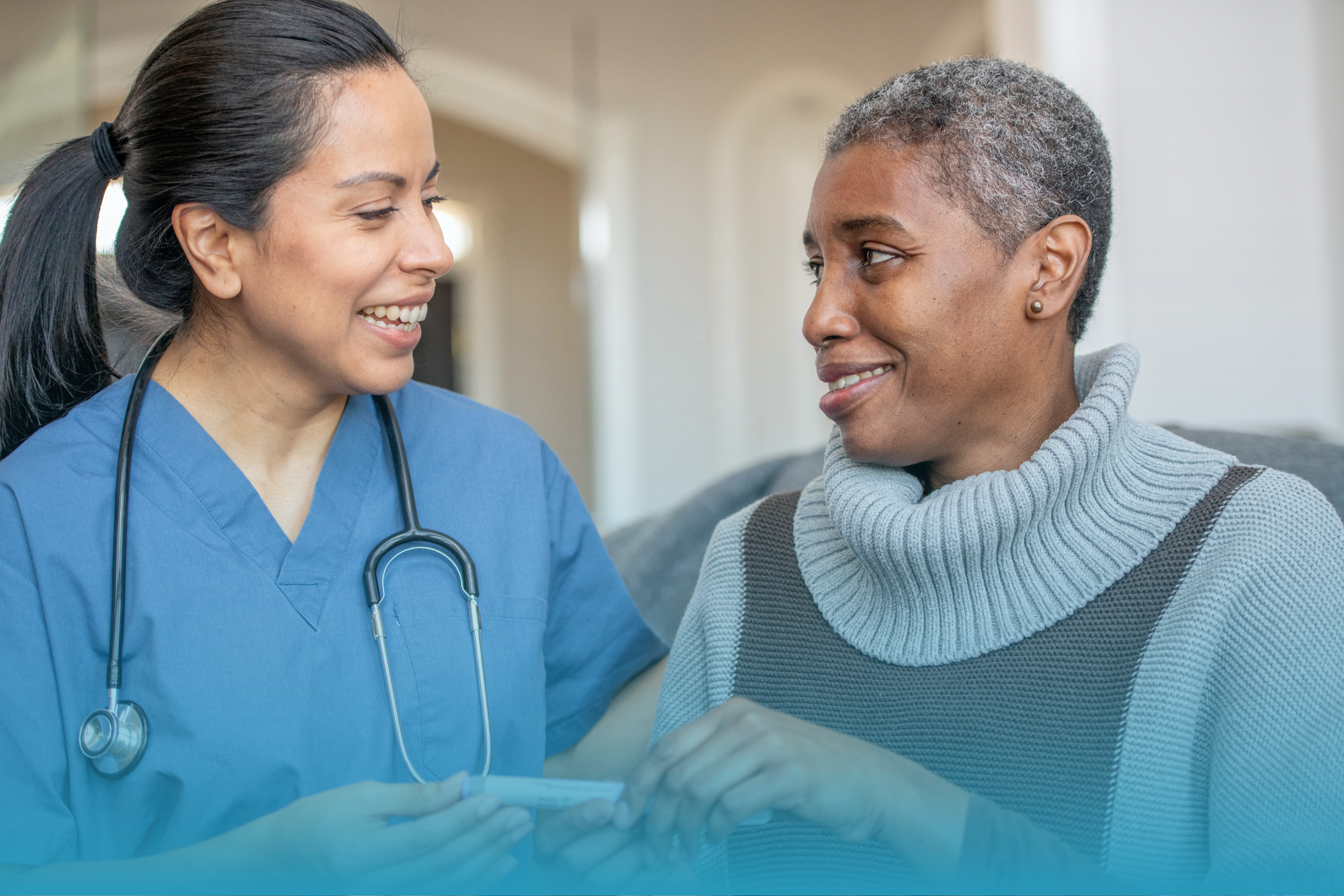 A young doctor with an edlerly patient. 